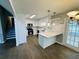 Bright kitchen with white cabinets, stainless steel appliances, and wood flooring at 208 Arbour Way, Suwanee, GA 30024