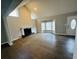Bright living room with hardwood floors, fireplace, and a bay window with natural light at 208 Arbour Way, Suwanee, GA 30024