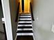 View of the interior staircase with dark wood and white trim at 208 Arbour Way, Suwanee, GA 30024