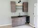 Charming wet bar with modern cabinetry and countertop at 208 Arbour Way, Suwanee, GA 30024