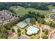Community aerial view featuring pool, tennis courts, playground, and golf course creating a luxurious and active lifestyle at 214 Misty View Dr, Canton, GA 30114