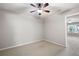 This bedroom features neutral walls, plush carpet, and ceiling fan for added comfort at 214 Misty View Dr, Canton, GA 30114