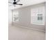 Bedroom featuring neutral carpeting and paint and two large windows at 214 Misty View Dr, Canton, GA 30114