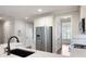 Kitchen area with stainless steel appliances, white cabinets, quartz countertops, and walk-in pantry at 214 Misty View Dr, Canton, GA 30114