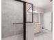 Spacious bathroom featuring a large tiled shower with glass enclosure and a vanity with ample storage at 214 Misty View Dr, Canton, GA 30114