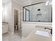 Beautiful main bathroom with a glass enclosed shower, dual vanities, and neutral color palette at 214 Misty View Dr, Canton, GA 30114