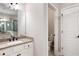 Well-lit main bathroom featuring a large vanity with dual sinks and a separate glass-enclosed shower at 214 Misty View Dr, Canton, GA 30114