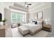 Elegant main bedroom featuring tray ceilings, neutral tones, and large windows for ample natural light at 214 Misty View Dr, Canton, GA 30114