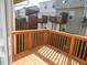 Wooden balcony with a view of the surrounding neighborhood at 2199 Landing Walk Dr, Duluth, GA 30097