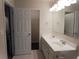 Bright bathroom with dual sinks, modern fixtures, and neutral decor at 2199 Landing Walk Dr, Duluth, GA 30097
