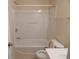 Standard white bathroom with a shower-tub combo with enclosure and standard toilet and sink at 2199 Landing Walk Dr, Duluth, GA 30097
