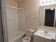 Standard bathroom with a white vanity, shower-tub combo with white enclosure and standard toilet at 2199 Landing Walk Dr, Duluth, GA 30097