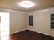 Inviting bedroom features hardwood floors, crown molding, and large windows at 2199 Landing Walk Dr, Duluth, GA 30097