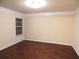 Spacious bedroom with hardwood floors, crown molding, and ample natural light at 2199 Landing Walk Dr, Duluth, GA 30097