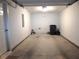 Empty garage with cement floor, and white walls, ready for a new homeowner's creative touch at 2199 Landing Walk Dr, Duluth, GA 30097