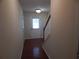 Entry hallway with wood floors leading to staircase at 2199 Landing Walk Dr, Duluth, GA 30097