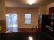View from the kitchen showcasing the granite countertops and a sliding glass door to the deck at 2199 Landing Walk Dr, Duluth, GA 30097
