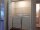 Laundry closet featuring a washer and dryer unit at 2199 Landing Walk Dr, Duluth, GA 30097