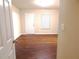 Living room with wood floors, natural light, and a view of the outdoors at 2199 Landing Walk Dr, Duluth, GA 30097