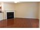 Cozy living room with hardwood floors, fireplace, and neutral paint colors at 2199 Landing Walk Dr, Duluth, GA 30097