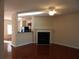 Open living room with hardwood floors, fireplace, and view into the kitchen at 2199 Landing Walk Dr, Duluth, GA 30097