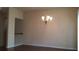 Open living room with beautiful hardwood floors and a chandelier at 2199 Landing Walk Dr, Duluth, GA 30097