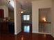 View of the living room from the kitchen with hardwood floors and staircase at 2199 Landing Walk Dr, Duluth, GA 30097