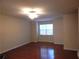 Bright living room with hardwood floors and a ceiling fan for comfort at 2199 Landing Walk Dr, Duluth, GA 30097