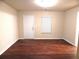 Bright living room featuring wood floors, white walls, and natural light at 2199 Landing Walk Dr, Duluth, GA 30097