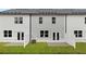 Townhome backyard featuring a patio area, green lawn, and privacy fencing at 321 Sound Cir, Stockbridge, GA 30281