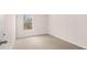 Bright bedroom with neutral walls, carpet, and a window providing natural light at 321 Sound Cir, Stockbridge, GA 30281