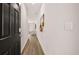 Bright hallway featuring hardwood floors that leads into a room with views of a stylish, comfortable space at 321 Sound Cir, Stockbridge, GA 30281