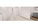 Hallway with neutral carpet leading to bedrooms and bathrooms at 321 Sound Cir, Stockbridge, GA 30281