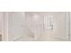 Bright hallway with neutral carpet, white doors, and natural light streaming in at 321 Sound Cir, Stockbridge, GA 30281