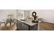 Bright kitchen with granite counters, a central island, stainless steel appliances, and an eat-in breakfast nook at 321 Sound Cir, Stockbridge, GA 30281