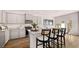 Modern kitchen with gray cabinets, granite countertops, and stainless steel appliances at 321 Sound Cir, Stockbridge, GA 30281