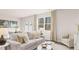 Living room features neutral colors, hardwood floors, large window bringing in natural light, and dining table at 321 Sound Cir, Stockbridge, GA 30281