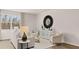 Stylish living room with elegant decor, ample seating, and a bright, inviting ambiance at 321 Sound Cir, Stockbridge, GA 30281