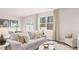 Cozy living room with plush sofa, nature view, and elegant decor creating a tranquil and inviting space at 321 Sound Cir, Stockbridge, GA 30281