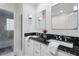 Elegant bathroom with black granite countertop, white cabinets and modern fixtures at 3609 Meadow Chase Dr, Marietta, GA 30062