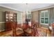 Charming dining room featuring a traditional table set and china cabinet at 3609 Meadow Chase Dr, Marietta, GA 30062
