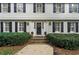 Inviting home facade with brick accents, black shutters, and landscaped front yard at 3609 Meadow Chase Dr, Marietta, GA 30062