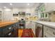 Updated kitchen with white cabinets, stainless steel appliances, and a center island with butcher block top at 3609 Meadow Chase Dr, Marietta, GA 30062