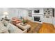 Cozy living room with a fireplace, built-in shelving, and shuttered windows at 3609 Meadow Chase Dr, Marietta, GA 30062