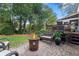 Outdoor patio features a fire pit and comfortable seating, perfect for entertaining or relaxing in the garden at 3609 Meadow Chase Dr, Marietta, GA 30062