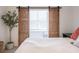 Bedroom features a window with sliding barn doors and wood accents at 361 Princeton Way, Lawrenceville, GA 30044