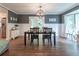Dining room with a dark wood table, bay window, and view to a modern kitchen at 361 Princeton Way, Lawrenceville, GA 30044
