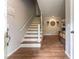 Home entryway boasts hardwood floors, staircase, and stylish decor, creating a warm and inviting ambiance at 361 Princeton Way, Lawrenceville, GA 30044