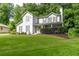 This well-maintained two-story home features mature landscaping and a inviting covered front porch at 361 Princeton Way, Lawrenceville, GA 30044