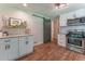 Updated kitchen with stainless steel appliances, granite counters and a sliding barn door at 361 Princeton Way, Lawrenceville, GA 30044